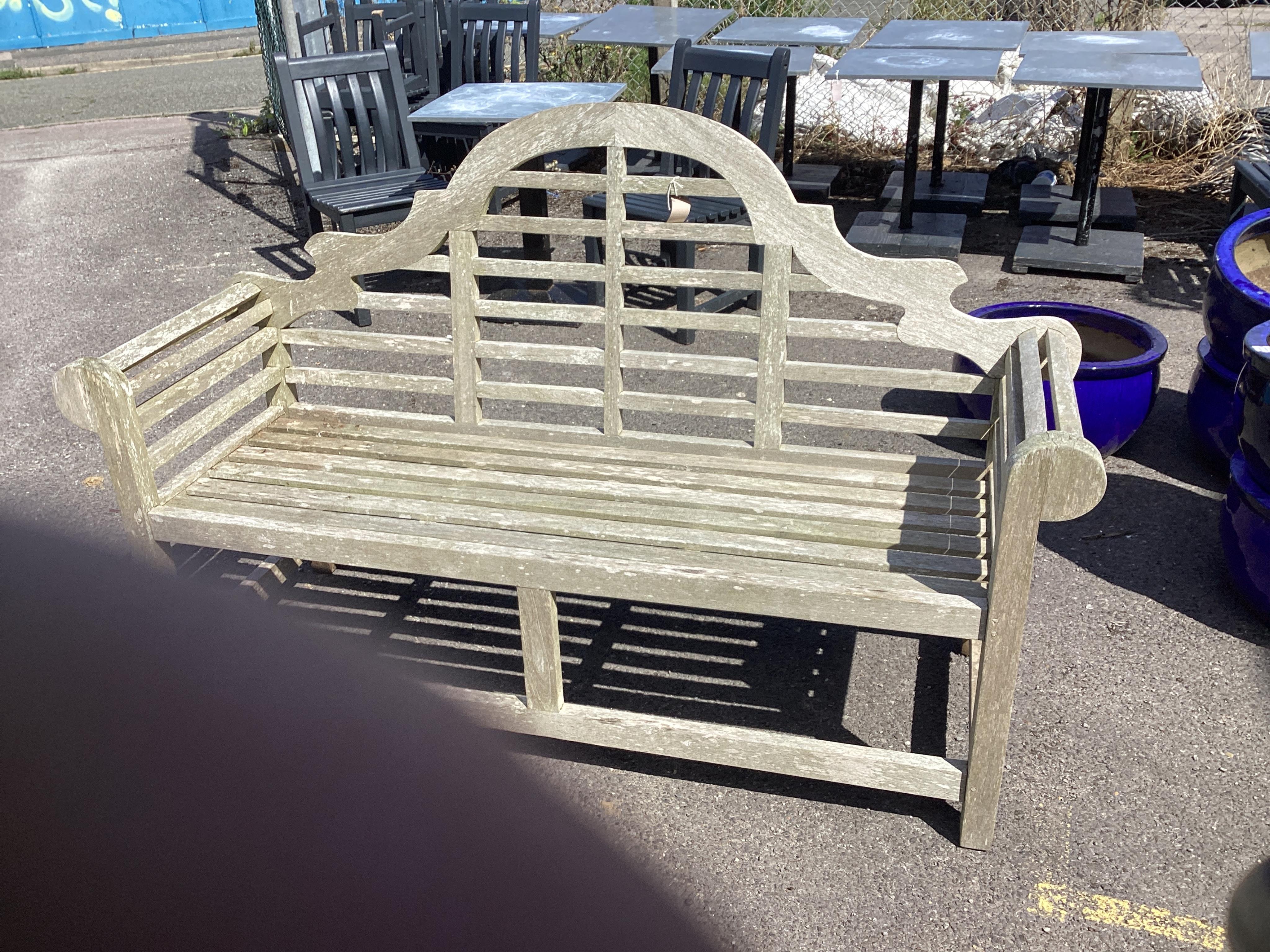 A weathered teak Lutyens style garden bench, width 162cm, depth 50cm, height 108cm. Condition - fair